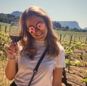 Meike in south africa with red wine glass in the hand