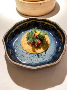 Roasted corn tortilla, drežnica lamb tartare, wild mustard, fake guacamole of lovage and broccoli.