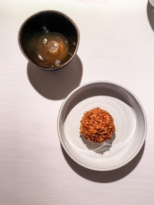 Tolminc cheese mochi filled with pear butter and elder blossom vinegar, hazelnuts.