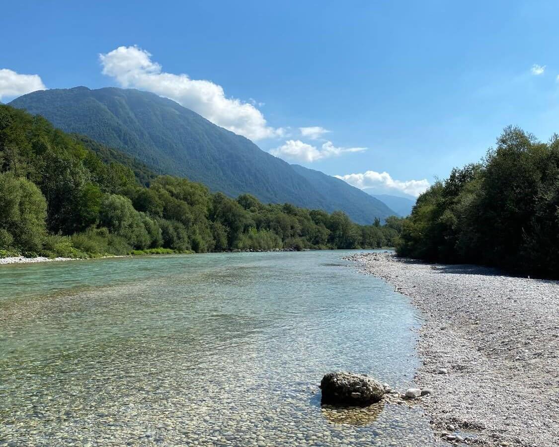 Soča-Valley emerald river with alps in the far distance