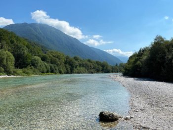 Soča-Valley emerald river with alps in the far distance